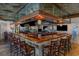 Upscale bar area featuring dark wood, comfortable seating, and mirrored accents at 9400 Shore Dr. # 124, Myrtle Beach, SC 29572