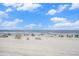A sunny day at the beach with beachgoers and clear ocean waters at 9400 Shore Dr. # 124, Myrtle Beach, SC 29572