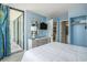 Well-lit bedroom with access to a balcony and an en-suite bathroom at 9400 Shore Dr. # 124, Myrtle Beach, SC 29572
