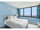 Inviting bedroom with a king bed and a large window offering ocean views at 9400 Shore Dr. # 124, Myrtle Beach, SC 29572