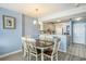 Dining area with seating for six and an adjacent kitchen and living room at 9400 Shore Dr. # 124, Myrtle Beach, SC 29572