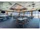 Oceanfront dining room with wicker chairs, tile-top tables, and expansive windows at 9400 Shore Dr. # 124, Myrtle Beach, SC 29572