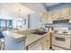 Kitchen featuring appliances and a view into the dining and living rooms at 9400 Shore Dr. # 124, Myrtle Beach, SC 29572