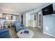 Living room featuring a bar area, with an adjacent view of the bathroom and kitchen and dining area at 9400 Shore Dr. # 124, Myrtle Beach, SC 29572