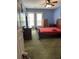 Cozy bedroom featuring blue walls, carpeted floors, and natural light from the window at 9779 Leyland Dr. # 3, Myrtle Beach, SC 29572