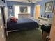 Comfortable bedroom with blue walls, white furniture, and a ceiling fan for added comfort at 9779 Leyland Dr. # 3, Myrtle Beach, SC 29572