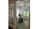 Bright sun room with exercise bike and seating area, perfect for relaxation at 9779 Leyland Dr. # 3, Myrtle Beach, SC 29572