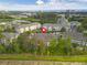 Aerial view of the community, showing landscaping, ponds, and ocean view at 1100 Possum Trot Rd. # H-233, North Myrtle Beach, SC 29582