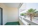 View from balcony showing an exterior view and a palm tree at 1100 Possum Trot Rd. # H-233, North Myrtle Beach, SC 29582