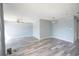 Large living room with gray walls, hardwood flooring, ceiling fan, and a bright, airy feel at 1100 Possum Trot Rd. # H-233, North Myrtle Beach, SC 29582