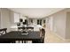 Open concept living room with hardwood floors, kitchen island, and view of the dining area at 1120 Oak Meadow Dr., Conway, SC 29526