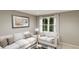 Bright living room featuring white sofas, large windows, and neutral decor at 1120 Oak Meadow Dr., Conway, SC 29526