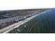 Stunning aerial view of beachfront homes, white sand, and ocean waves, highlighting coastal living at 122 Westfield Circle, Conway, SC 29526