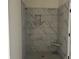 New marble tiled shower with niche and shower seat at 122 Westfield Circle, Conway, SC 29526