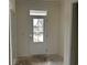 Bright entryway showcasing a white door with glass panes and a transom window to let natural light in at 122 Westfield Circle, Conway, SC 29526