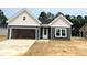 New construction featuring a blend of gray and white siding, attached garage and concrete driveway at 122 Westfield Circle, Conway, SC 29526