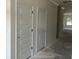 Clean hallway with white doors offers a blank canvas for personalization in a modern home at 122 Westfield Circle, Conway, SC 29526