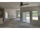 Unfinished living room and kitchen featuring a ceiling fan, sliding glass door and light fixtures at 122 Westfield Circle, Conway, SC 29526