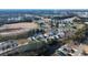 Aerial view of lakeside community with lake and tree-lined streets at 1228 Barrington Way, Conway, SC 29526
