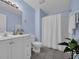 Bathroom featuring a vanity with white cabinets and shower with white curtain at 137 Maiden Ln., Myrtle Beach, SC 29588