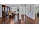 Formal dining room with hardwood floors and a china cabinet near the entrance at 137 Maiden Ln., Myrtle Beach, SC 29588