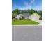 Charming single-story home with manicured lawn, a lovely palm tree and an attached two car garage at 137 Maiden Ln., Myrtle Beach, SC 29588