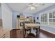 Bright living room with a ceiling fan, wood floors, and a round table at 137 Maiden Ln., Myrtle Beach, SC 29588