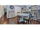 Bright living room featuring a ceiling fan, wood floors, and art storage at 137 Maiden Ln., Myrtle Beach, SC 29588
