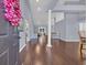 Spacious living room featuring hardwood floors, a decorative column, and neutral paint at 137 Maiden Ln., Myrtle Beach, SC 29588