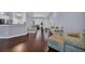 Open living space with hardwood floors connecting the kitchen, dining, and sitting area at 137 Maiden Ln., Myrtle Beach, SC 29588