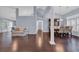 Open-concept living space with hardwood floors and a dining area nearby at 137 Maiden Ln., Myrtle Beach, SC 29588
