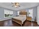Spacious main bedroom with hardwood flooring, ceiling fan, large window and ensuite bathroom at 137 Maiden Ln., Myrtle Beach, SC 29588