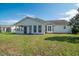 Well-maintained backyard boasts a screened porch and fencing, enhancing the outdoor living and privacy at 1388 Gailard Dr., Conway, SC 29526