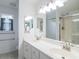 Bathroom featuring double sinks, large mirror, and a separate shower and toilet area at 1388 Gailard Dr., Conway, SC 29526