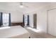 Bright bedroom with two windows and adjacent bathroom access at 1388 Gailard Dr., Conway, SC 29526