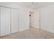 Clean bedroom with double door closet, light carpet, and a ceiling fan with integrated lighting at 1388 Gailard Dr., Conway, SC 29526