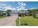 Charming brick home with a well-manicured lawn, mature landscaping, and a spacious two-car garage at 1388 Gailard Dr., Conway, SC 29526