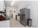 Modern kitchen features stainless steel appliances and neutral tiled floors at 1388 Gailard Dr., Conway, SC 29526