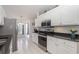 Bright kitchen featuring white cabinets, stainless steel appliances, and tile flooring at 1388 Gailard Dr., Conway, SC 29526