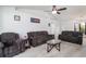 Relaxing living room boasts comfortable seating, soft carpet, and a ceiling fan at 1388 Gailard Dr., Conway, SC 29526