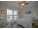 Bright bedroom with large windows, comfortable bedding, and calming, neutral decor at 148 Splendor Circle, Murrells Inlet, SC 29576