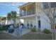Charming two-story home with a spacious patio and balcony, ideal for outdoor living and entertaining at 148 Splendor Circle, Murrells Inlet, SC 29576