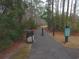 Scenic walking path through a peaceful wooded area, perfect for leisurely strolls and exercise at 148 Splendor Circle, Murrells Inlet, SC 29576