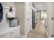 Inviting hallway with a mudroom bench, offering access to the kitchen and other areas of the home at 1517 Hope Pointe Dr, North Myrtle Beach, SC 29582