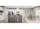 Bright kitchen featuring white cabinets, stainless steel appliances, and an eat-in dining area at 1517 Hope Pointe Dr, North Myrtle Beach, SC 29582