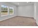 Bedroom showcasing carpet floors, neutral paint, window, and base trim at 1529 Bucksport Rd., Conway, SC 29527