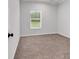 Bright bedroom featuring carpeted floors and a large window at 1529 Bucksport Rd., Conway, SC 29527