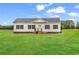 Charming single-story home with a well-maintained lawn and classic design against a bright sky at 1529 Bucksport Rd., Conway, SC 29527