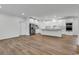 Bright, open-concept kitchen featuring white cabinetry, stainless steel appliances, and wood-look flooring at 1529 Bucksport Rd., Conway, SC 29527