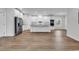 Bright, open-concept kitchen featuring white cabinetry, stainless steel appliances, and wood-look flooring at 1529 Bucksport Rd., Conway, SC 29527